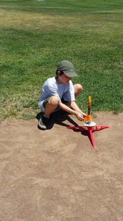 A scout learns how to setup the rocket on the launchpad